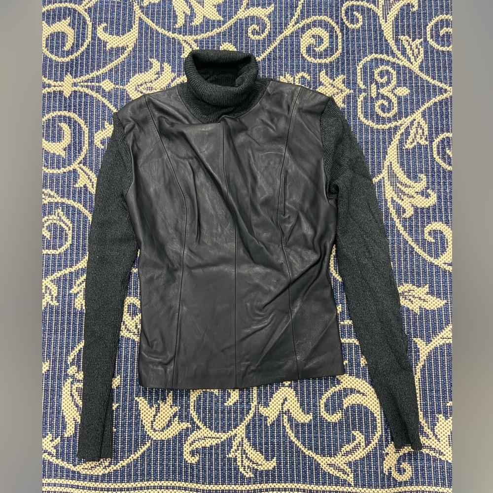 Posh turtleneck sweater with a leather front section.